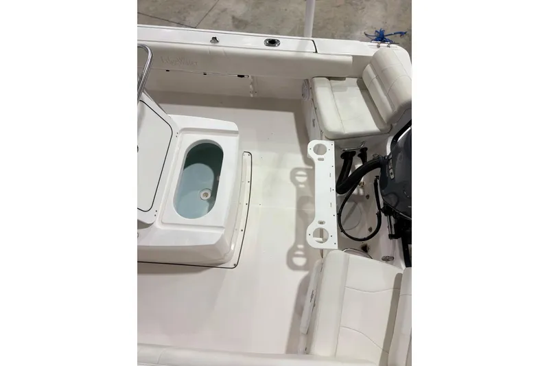 Slide: The Image of 2021 Edgewater 188CC boat interior with seating and storage compartments. - 14