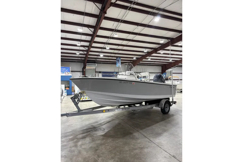 Slide: The Image of 2021 Edgewater 188CC boat on trailer in indoor showroom. - 2