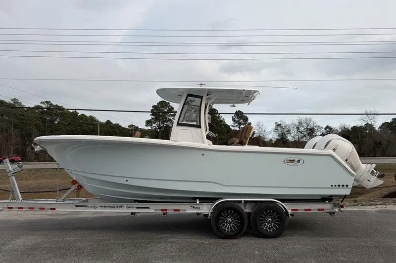 The Image of 2026 Sea Hunt Gamefish 25 boat on trailer, side view, outdoors. - 1