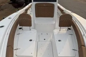 Slide: The Image of 2026 Sea Hunt Gamefish 25 boat interior with seating and storage compartments. - 11