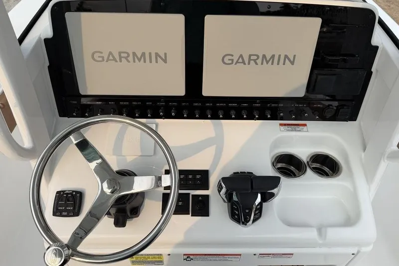 Slide: The Image of Helm of 2026 Sea Hunt Gamefish 25 with Garmin displays and controls. - 18