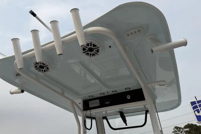 Slide: The Image of 2026 Sea Hunt Gamefish 25 boat T-top with rod holders and speakers. - 19