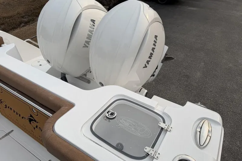 Slide: The Image of 2026 Sea Hunt Gamefish 25 boat with dual Yamaha outboard engines. - 20