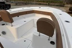 Slide: The Image of 2026 Sea Hunt Gamefish 25 boat interior with seating and storage compartments. - 6