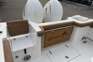 Slide: The Image of 2026 Sea Hunt Gamefish 25 boat interior with seating and storage compartments. - 7