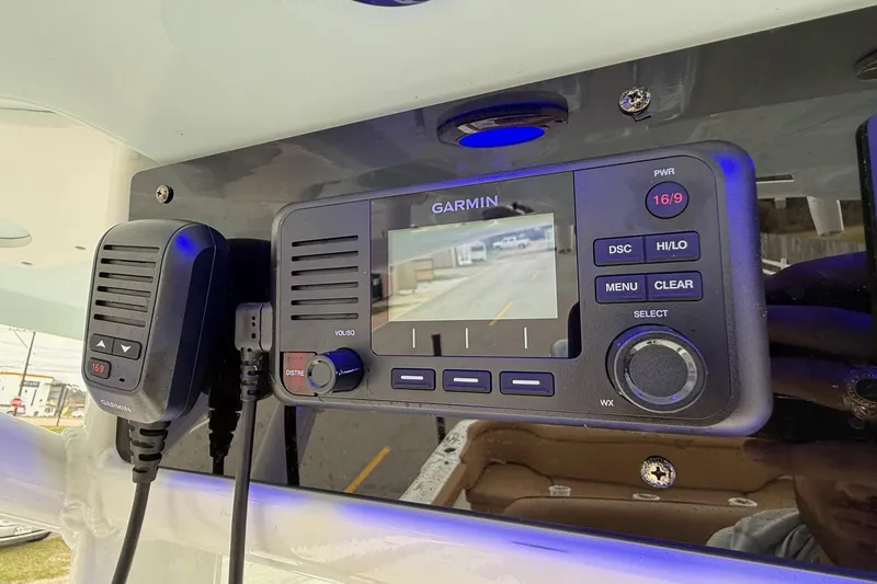 Slide: The Image of Garmin marine radio and display on 2022 Sea Hunt Ultra 265 SE boat. - 18