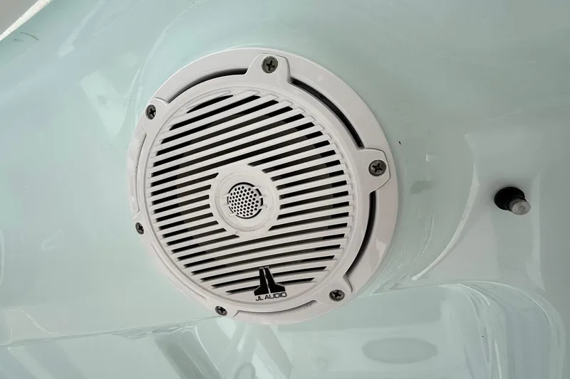 Slide: The Image of White JL Audio speaker on 2022 Sea Hunt Ultra 265 SE boat. - 19