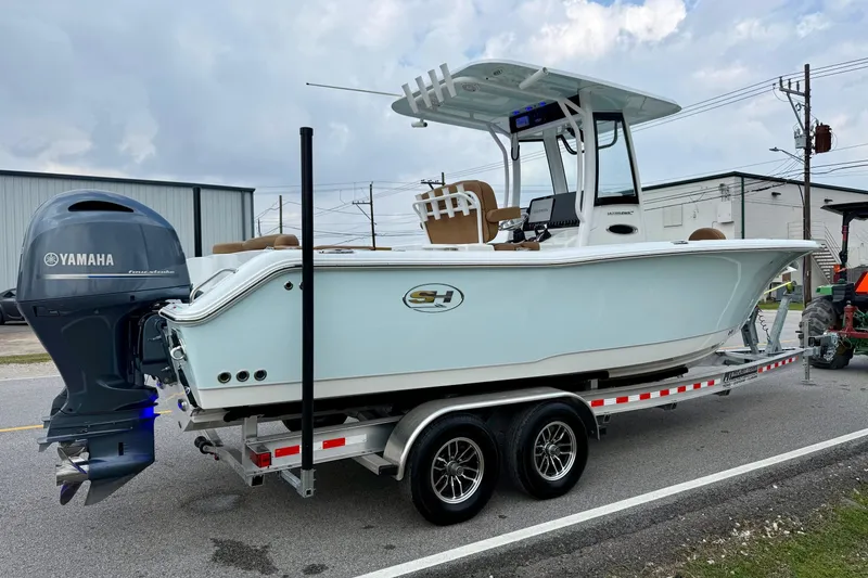Slide: The Image of 2022 Sea Hunt Ultra 265 SE boat on trailer with Yamaha outboard motor. - 4
