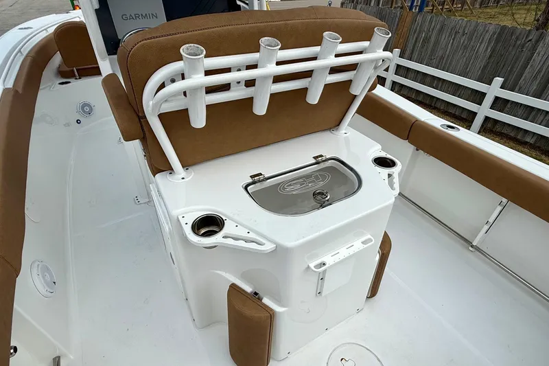 Slide: The Image of 2022 Sea Hunt Ultra 265 SE boat interior with rod holders and seating. - 8