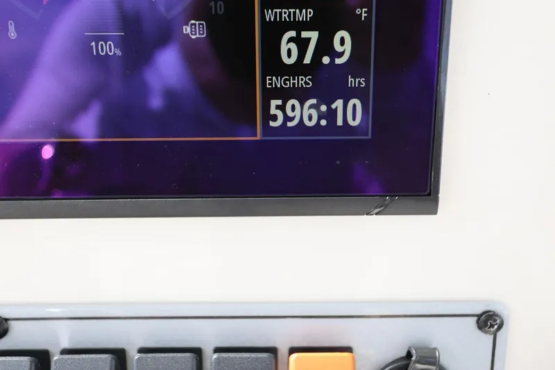 Slide: The Image of Dashboard display of a 2015 Key West 219 FS showing water temperature and engine hours. - 24