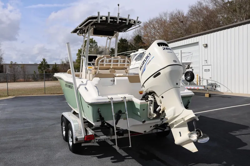 Slide: The Image of 2015 Key West 219 FS boat with Suzuki outboard motor on trailer. - 3