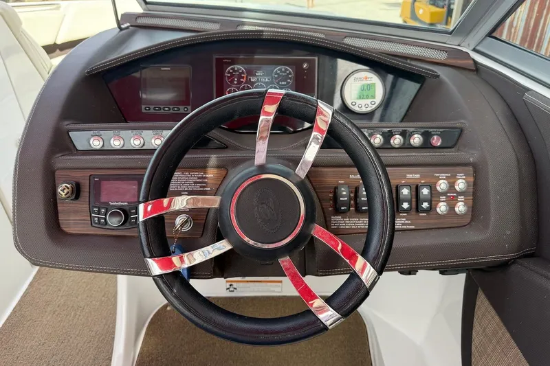 Slide: The Image of Steering wheel and dashboard of 2017 Cobalt R3 WSS Surf boat. - 10