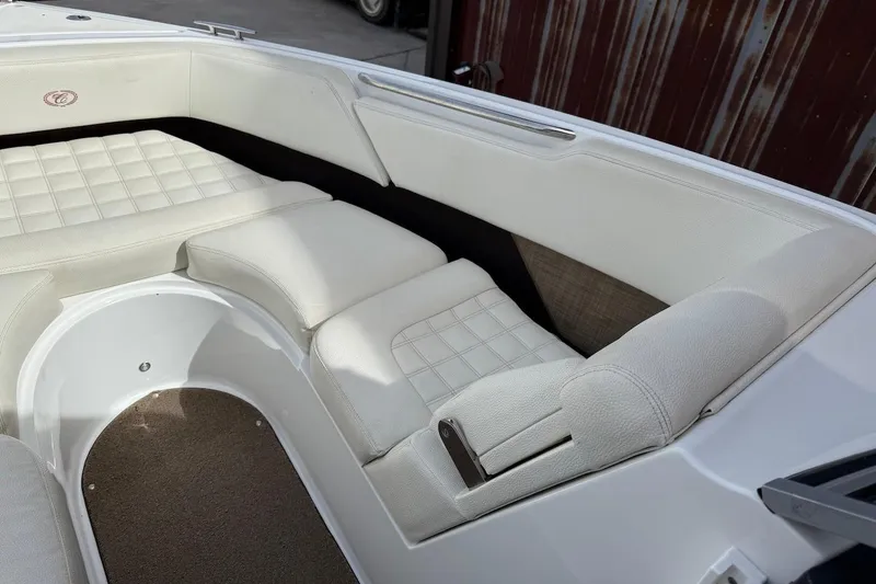 Slide: The Image of 2017 Cobalt R3 WSS Surf boat interior with white cushioned seating. - 14