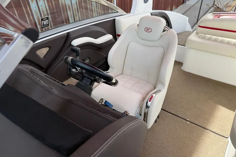 Slide: The Image of 2017 Cobalt R3 WSS Surf boat interior with steering wheel and white captain's seat. - 16