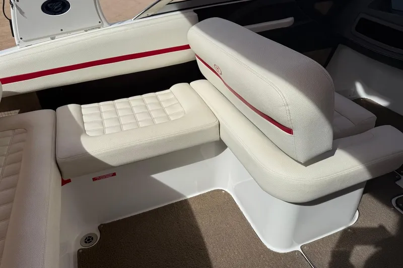 Slide: The Image of 2017 Cobalt R3 WSS Surf boat interior with white seating and red accents. - 7