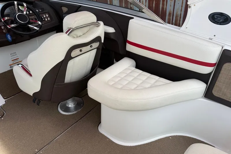 Slide: The Image of 2017 Cobalt R3 WSS Surf boat interior with white and red seating, steering wheel, and dashboard. - 9