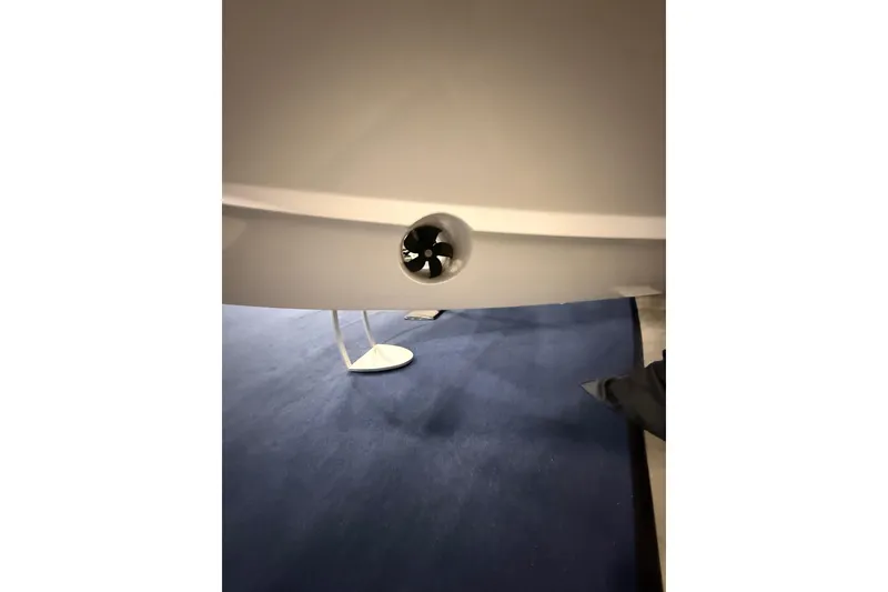 Slide: The Image of 2026 Monterey Elite 25 SD boat hull with a visible thruster on display. - 2