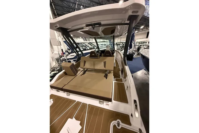 Slide: The Image of 2026 Monterey Elite 25 SD boat interior with tan seating and modern design. - 5