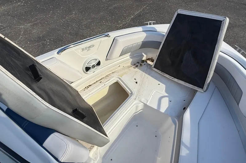 Slide: The Image of 2019 Chaparral 21 H2O Surf boat interior with open storage compartments. - 14