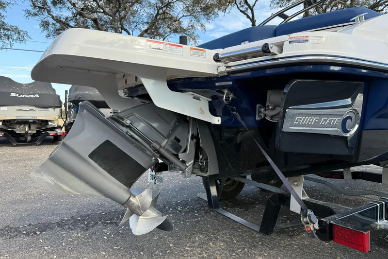 Slide: The Image of 2019 Chaparral 21 H2O Surf boat with visible propeller and Surf Gate system. - 4