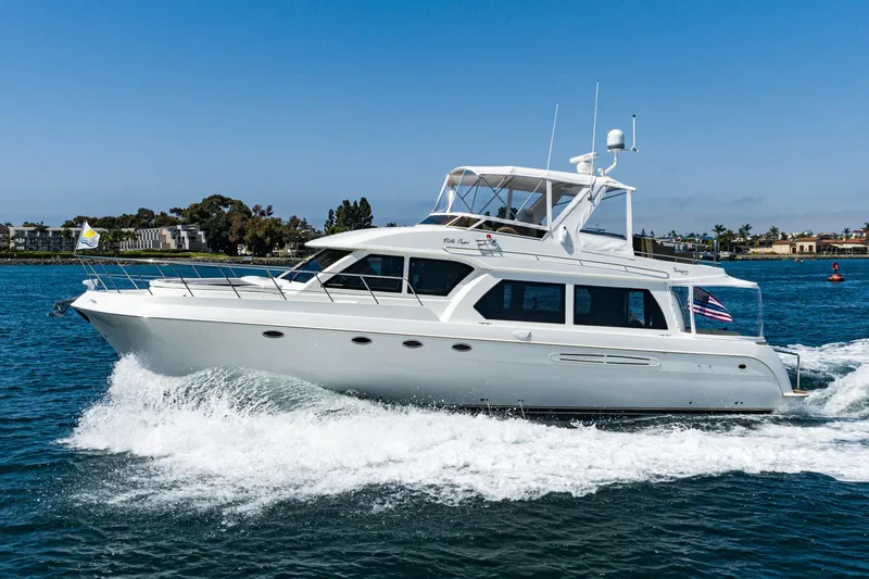 The Image of 2006 Navigator 5100 yacht cruising on blue water under clear skies. - 0