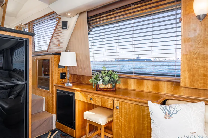 Slide: The Image of Luxurious 2006 Navigator 5100 yacht interior with wood finish, window view, and elegant decor. - 11