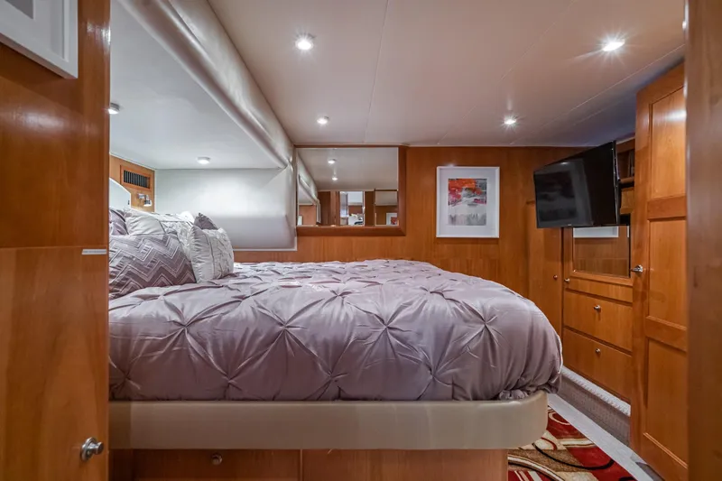 Slide: The Image of Luxurious bedroom interior of 2006 Navigator 5100 yacht with cozy bedding and modern decor. - 30