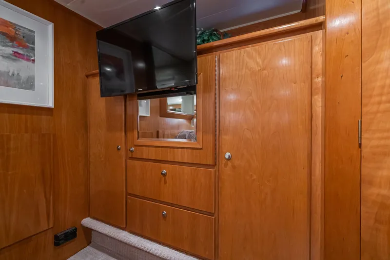Slide: The Image of Interior of 2006 Navigator 5100 yacht with wood cabinetry and mounted TV. - 35