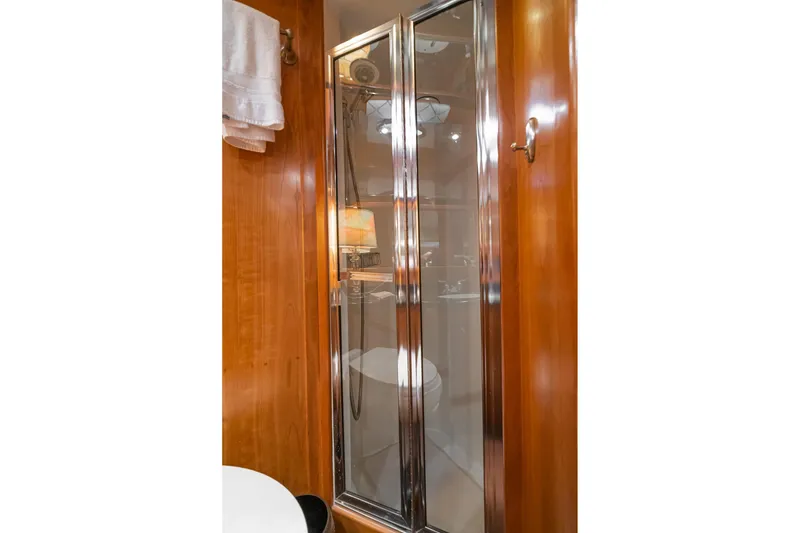 Slide: The Image of Bathroom interior of 2006 Navigator 5100 yacht with glass shower door. - 38