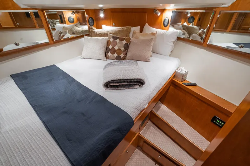 Slide: The Image of Luxurious bedroom in 2006 Navigator 5100 yacht with cozy bedding and elegant wood accents. - 42