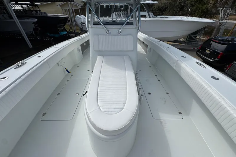 Slide: The Image of 2016 Freeman 37VH boat interior with white seating and storage compartments. - 20