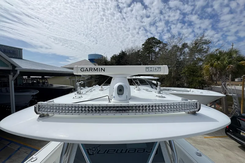 Slide: The Image of 2016 Freeman 37VH boat with Garmin xHD2 radar, under a partly cloudy sky. - 21