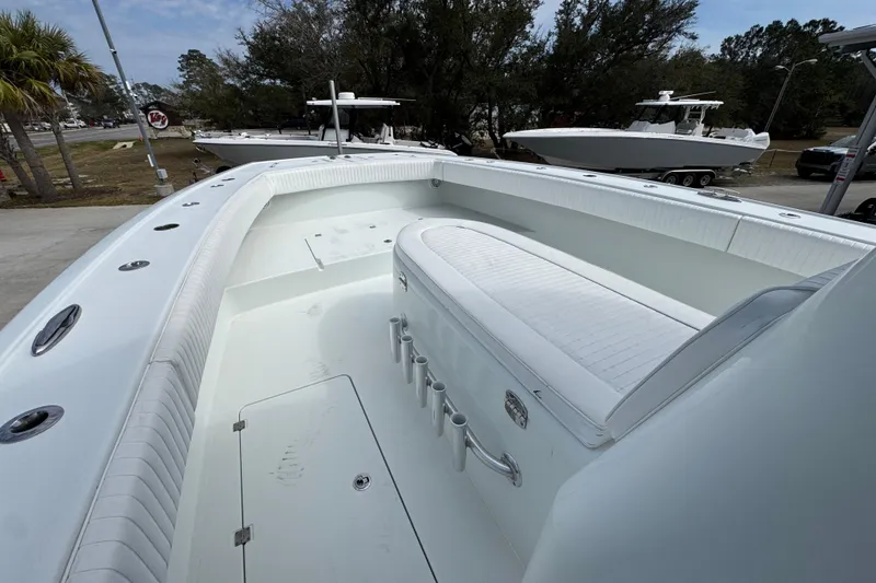 Slide: The Image of Freeman 37VH 2016 boat interior with white seating and storage compartments. - 22
