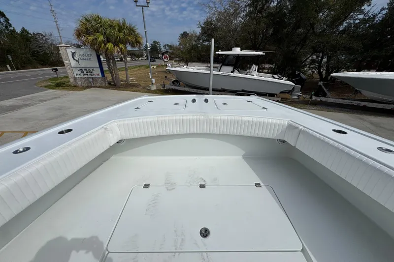 Slide: The Image of 2016 Freeman 37VH boat interior with white seating and storage compartments. - 23