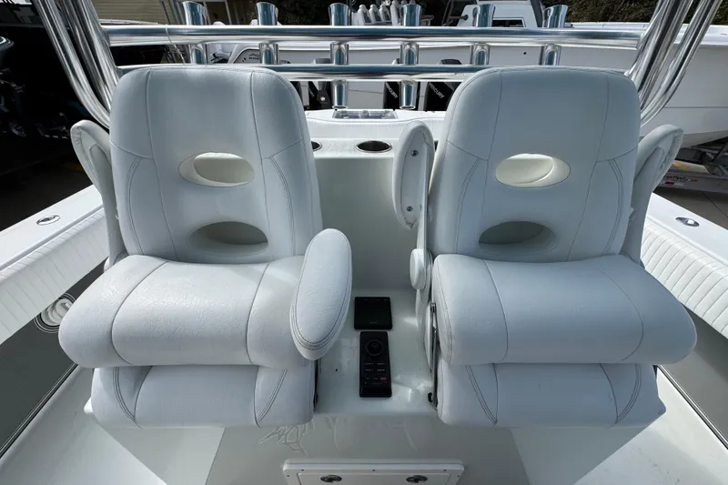 Slide: The Image of Luxury seating on a 2016 Freeman 37VH boat, featuring plush white cushions and armrests. - 29