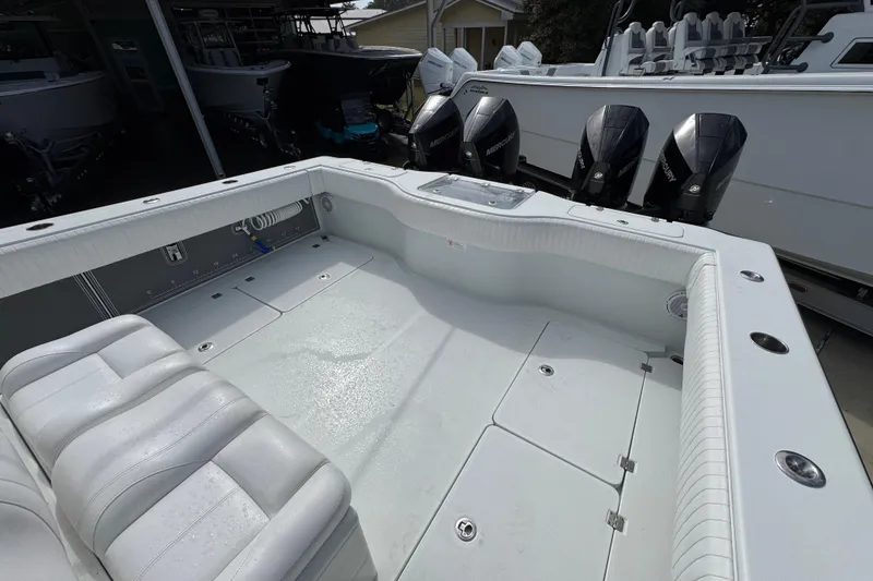 Slide: The Image of 2016 Freeman 37VH boat interior with seating and multiple outboard motors. - 39