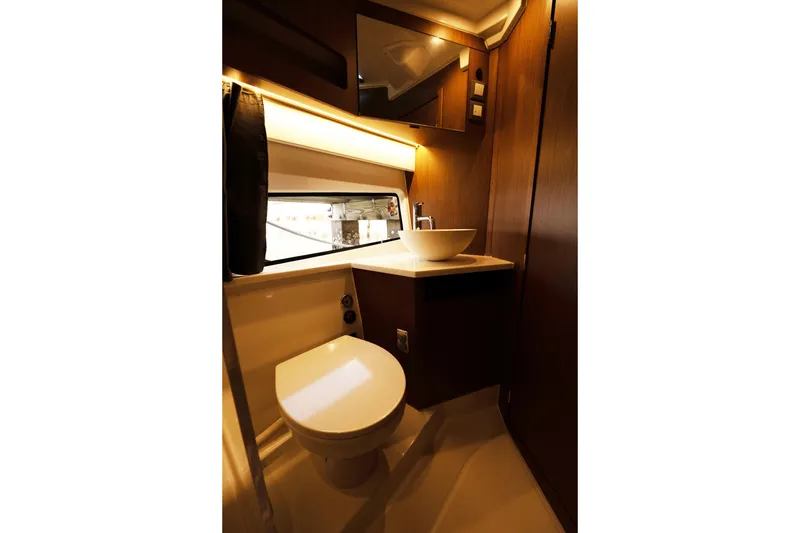 Slide: The Image of Luxurious bathroom in 2022 Beneteau Antares 11 Coupe yacht, featuring modern fixtures and elegant design. - 18