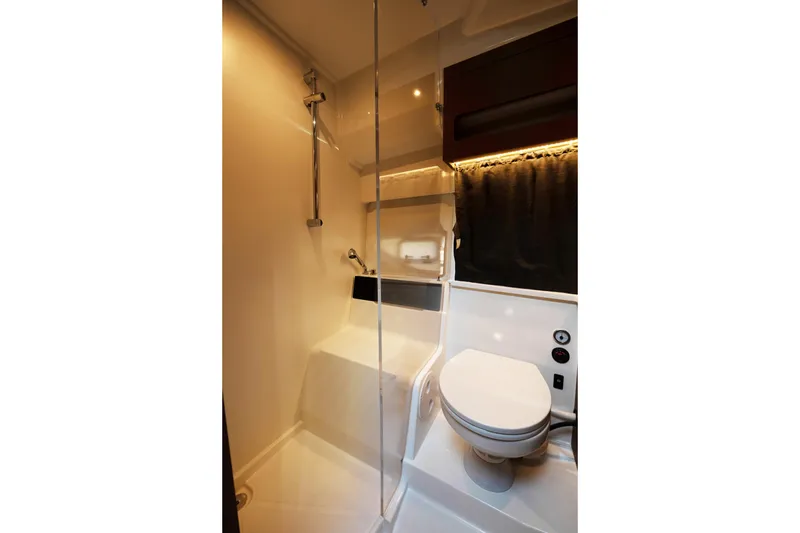 Slide: The Image of Bathroom interior of 2022 Beneteau Antares 11 Coupe, featuring modern shower and toilet. - 19