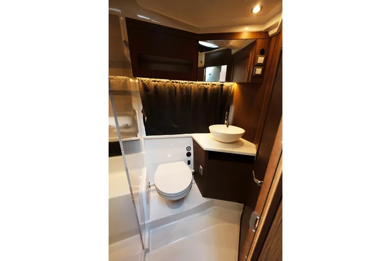 Slide: The Image of 2022 Beneteau Antares 11 Coupe bathroom with modern fixtures and elegant design. - 20