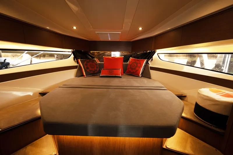 Slide: The Image of Luxurious interior cabin of 2022 Beneteau Antares 11 Coupe with elegant bedding and ambient lighting. - 21