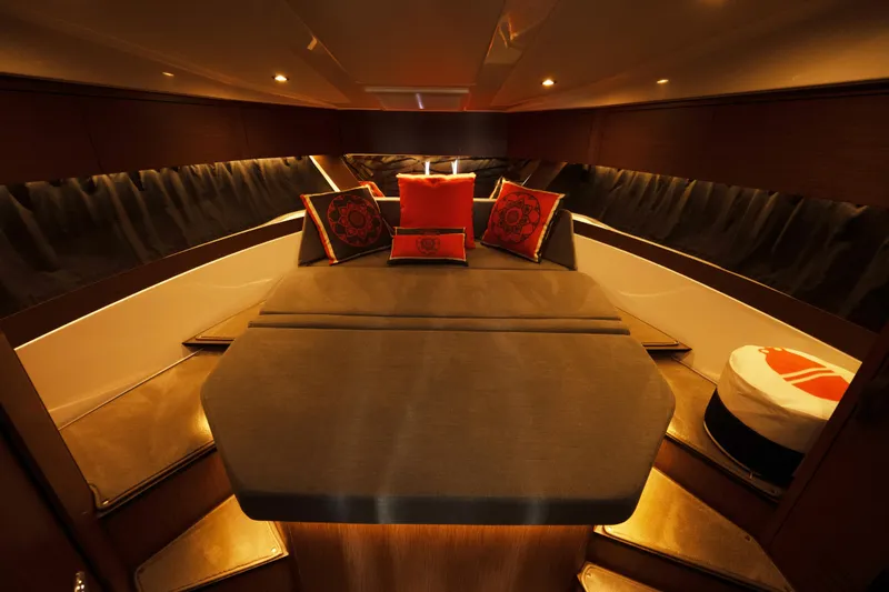 Slide: The Image of Luxurious interior of 2022 Beneteau Antares 11 Coupe with elegant bedding and ambient lighting. - 23