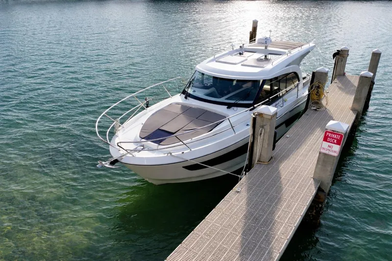 Slide: The Image of 2022 Beneteau Antares 11 Coupe docked at a private pier. - 7