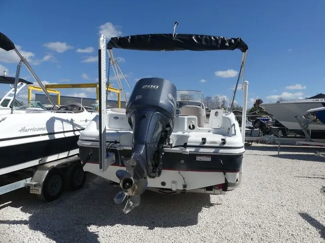 Slide: The Image of 2013 Hurricane SUNDECK SPORT SS 231 OB boat with outboard motor. - 3