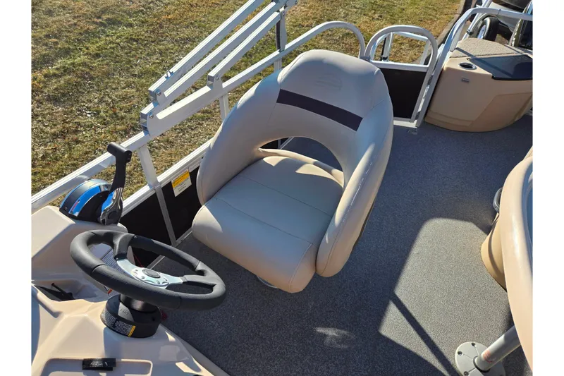 Slide: The Image of 2018 Sun Tracker Fishin' Barge 20 DLX interior with steering wheel and captain's chair. - 18