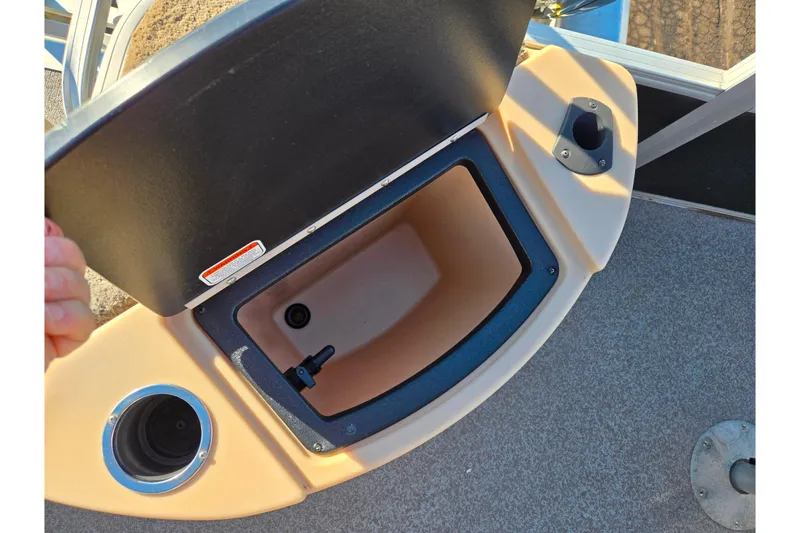 Slide: The Image of Open storage compartment on 2018 Sun Tracker Fishin' Barge 20 DLX boat. - 22
