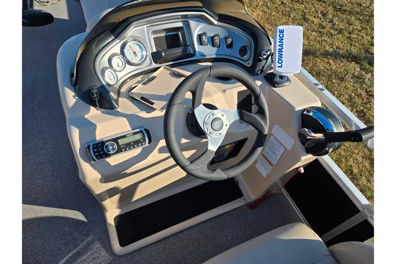 Slide: The Image of 2018 Sun Tracker Fishin' Barge 20 DLX dashboard with steering wheel and Lowrance device. - 26