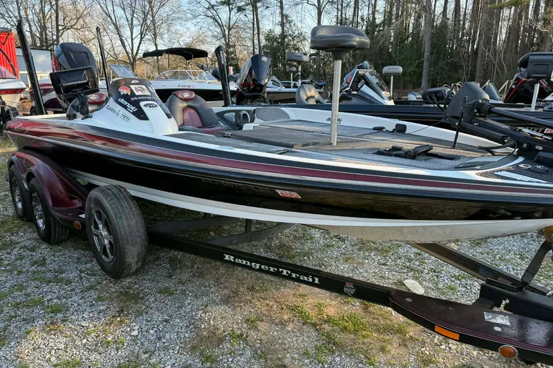 The Image of 2005 Ranger Z20 Comanche bass boat on trailer, parked outdoors. - 0