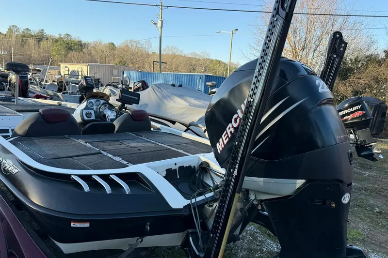 Slide: The Image of 2005 Ranger Z20 Comanche boat with Mercury engine in a storage yard. - 4
