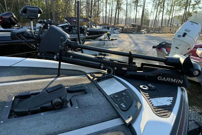 Slide: The Image of 2005 Ranger Z20 Comanche boat with Garmin trolling motor in a wooded area. - 8