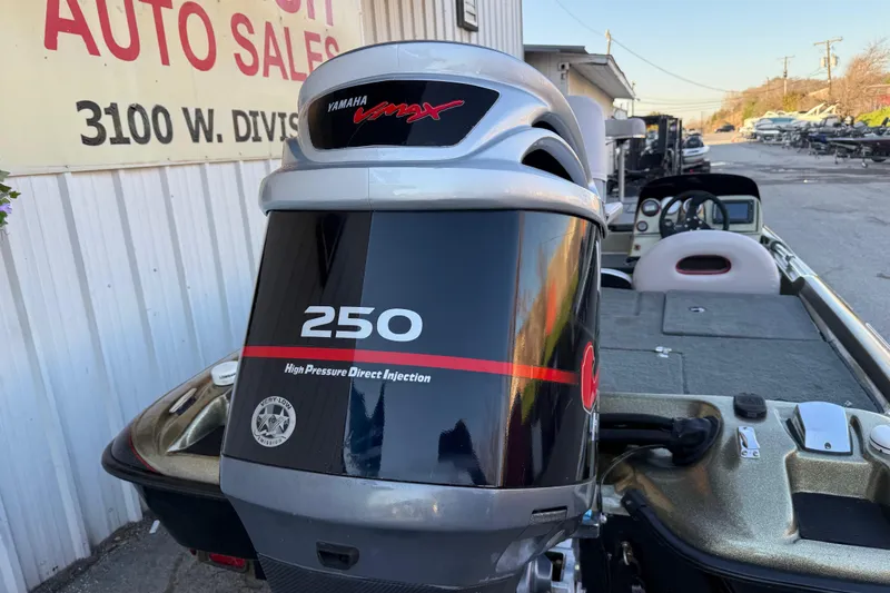 Slide: The Image of 2005 Bass Cat Puma boat with Yamaha VMAX 250 engine at auto sales location. - 12